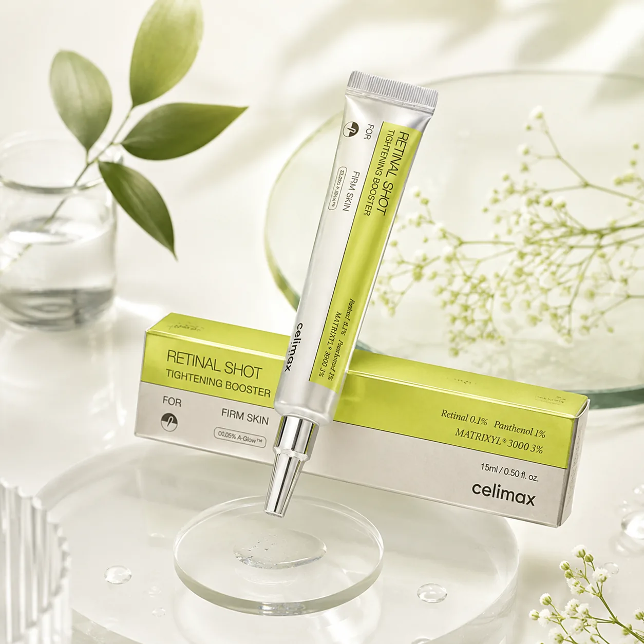 Celimax Retinal Shot 0.1 en composicion editorial con hojas y cristaleria